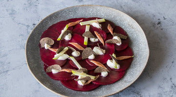 Beetroot carpaccio with crème fraîche, apple, anchovy and black truffle